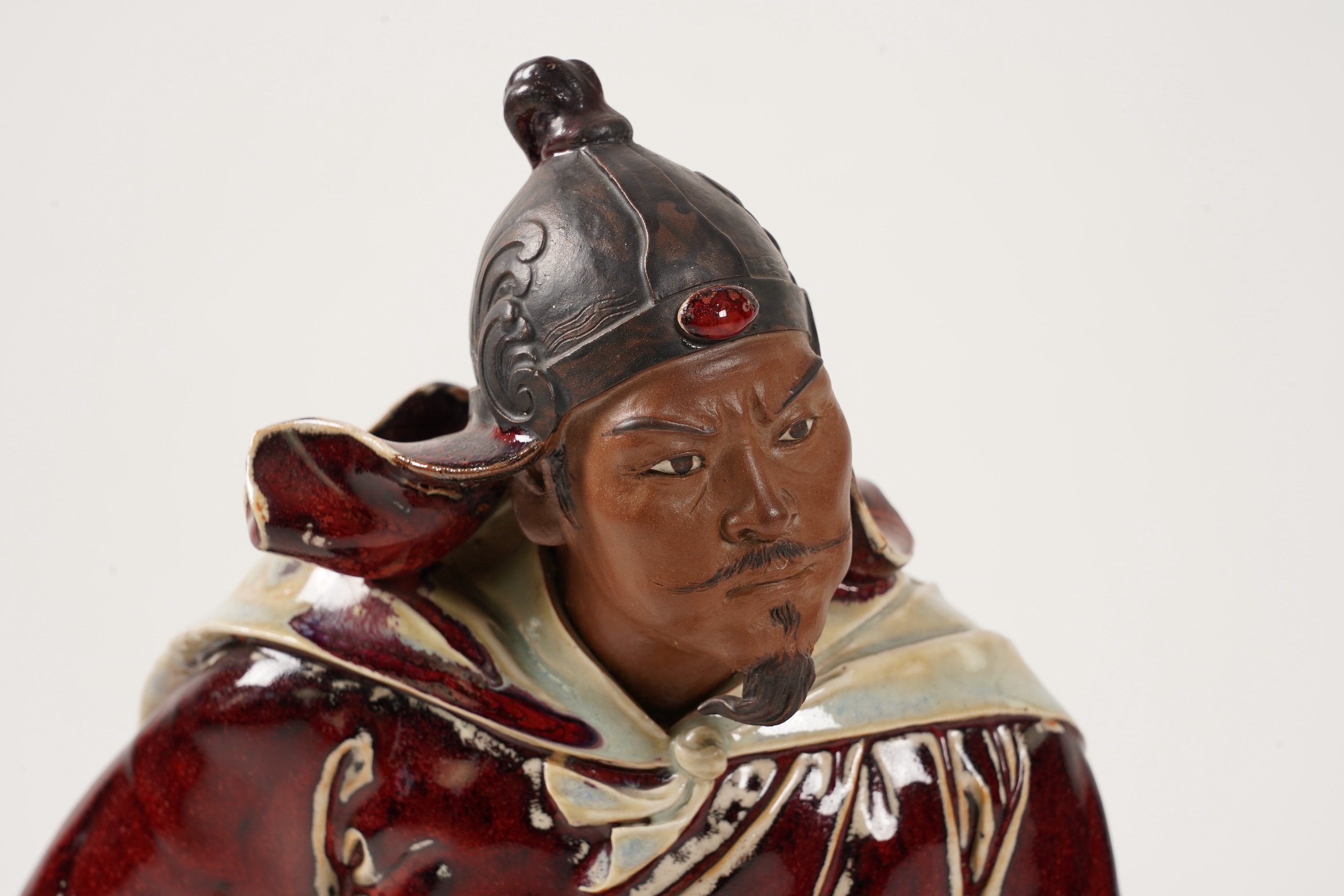 A large Chinese Shiwan stoneware figure of a warrior, 20th century
